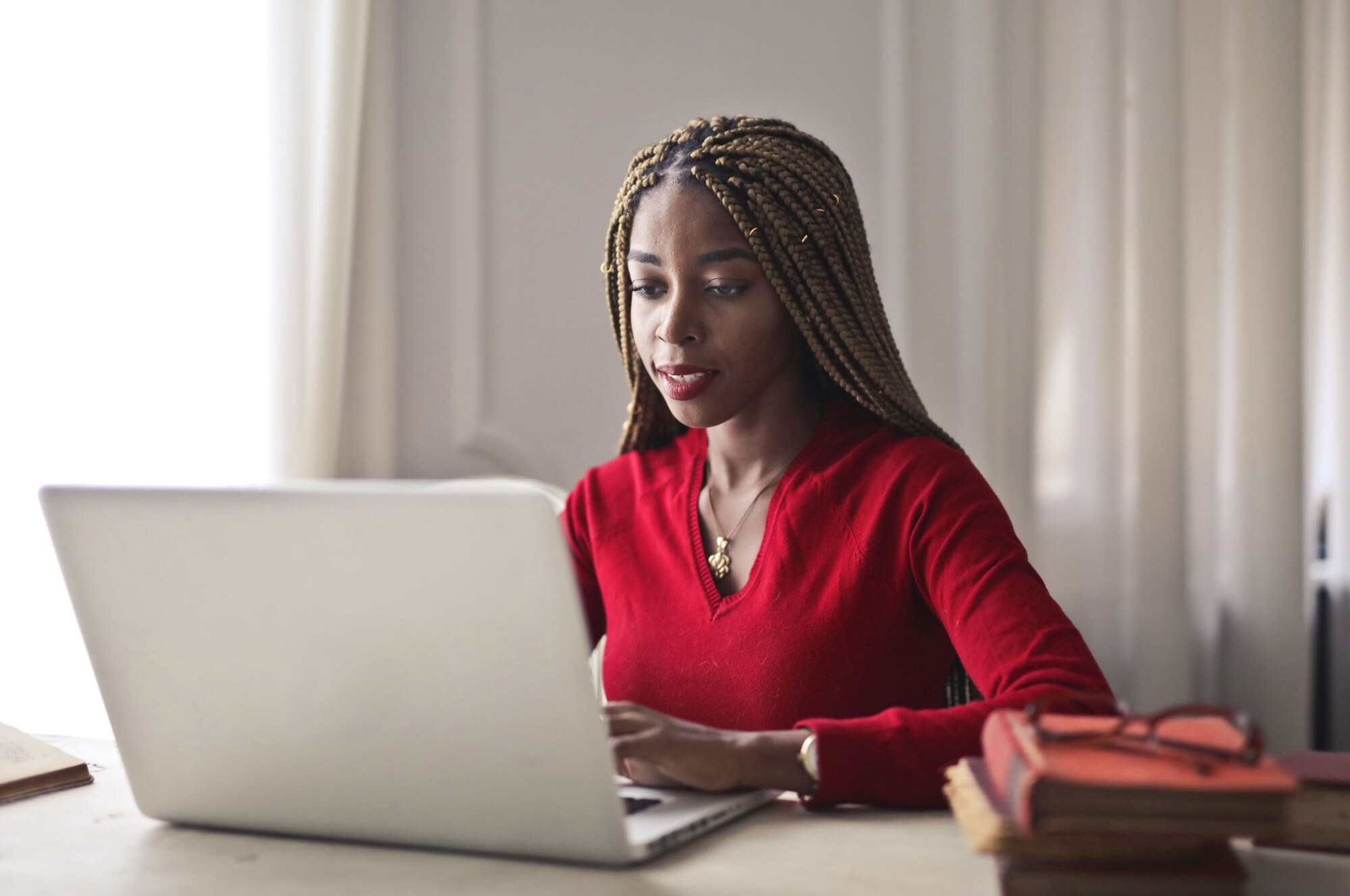 A woman working confidently at a laptop